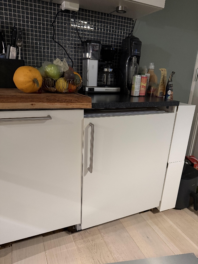 Løfte integrert vaskemaskin