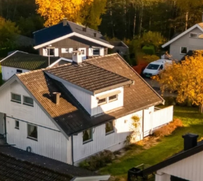 Graving og drenering av en side av ett hus