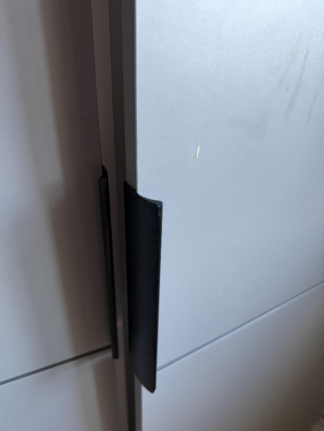 Fixing the fridge n freezer door